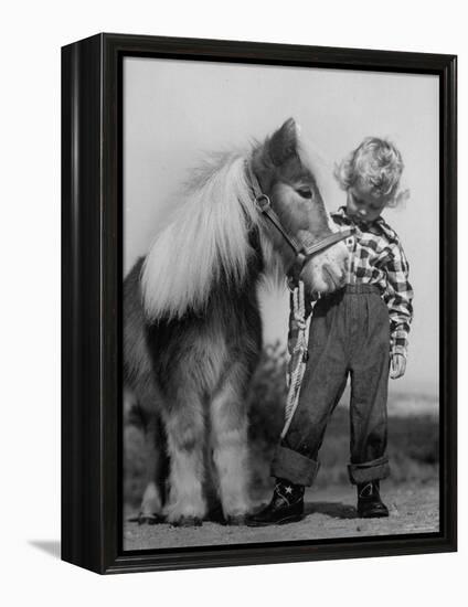 Child Standing Beside a Miniature Horse, Showing Size Comparison-Ed Clark-Framed Premier Image Canvas