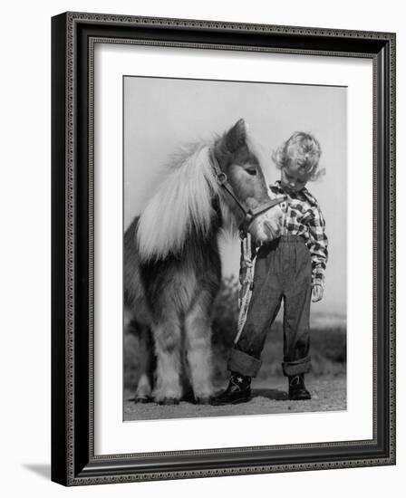 Child Standing Beside a Miniature Horse, Showing Size Comparison-Ed Clark-Framed Photographic Print