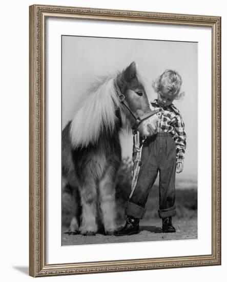 Child Standing Beside a Miniature Horse, Showing Size Comparison-Ed Clark-Framed Photographic Print