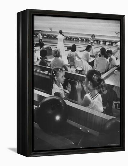 Children Entertaining Themselves While Their Mothers Compete in Bowling League-Stan Wayman-Framed Premier Image Canvas