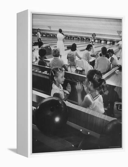 Children Entertaining Themselves While Their Mothers Compete in Bowling League-Stan Wayman-Framed Premier Image Canvas