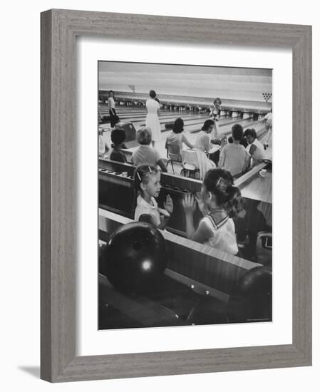 Children Entertaining Themselves While Their Mothers Compete in Bowling League-Stan Wayman-Framed Photographic Print