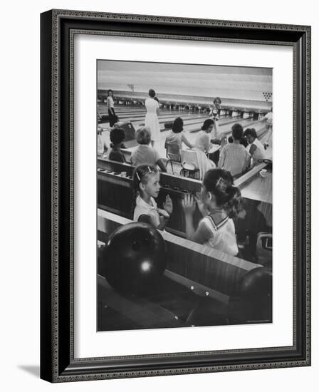 Children Entertaining Themselves While Their Mothers Compete in Bowling League-Stan Wayman-Framed Photographic Print