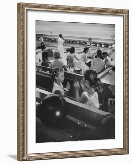 Children Entertaining Themselves While Their Mothers Compete in Bowling League-Stan Wayman-Framed Photographic Print