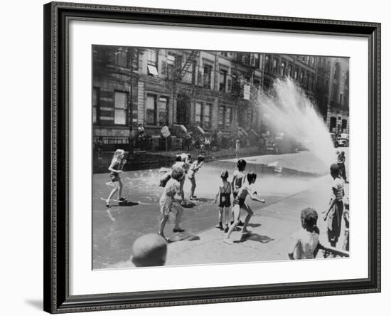 Children Escape the Heat of the East Side by Opening a Fire Hydrant, New York City, June 1943-null-Framed Photo