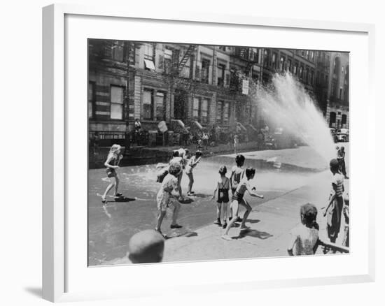 Children Escape the Heat of the East Side by Opening a Fire Hydrant, New York City, June 1943-null-Framed Photo