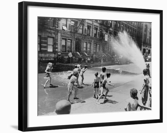 Children Escape the Heat of the East Side by Opening a Fire Hydrant, New York City, June 1943-null-Framed Photo