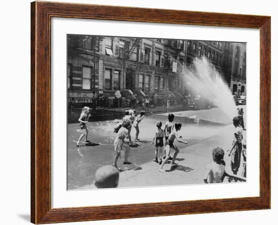 Children Escape the Heat of the East Side by Opening a Fire Hydrant, New York City, June 1943-null-Framed Photo