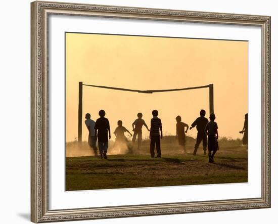 Children from the Toba Qom Ethnic Group Play Soccer During Indegenous Indian Day Celebration-null-Framed Photographic Print