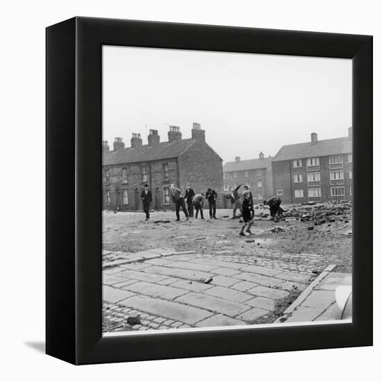 Children in a Deserted Liverpool Street Throw Bricks and Rubble-Henry Grant-Framed Premier Image Canvas