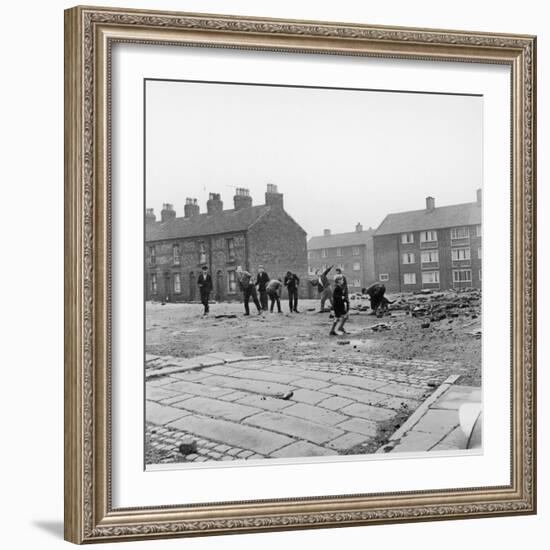 Children in a Deserted Liverpool Street Throw Bricks and Rubble-Henry Grant-Framed Photographic Print