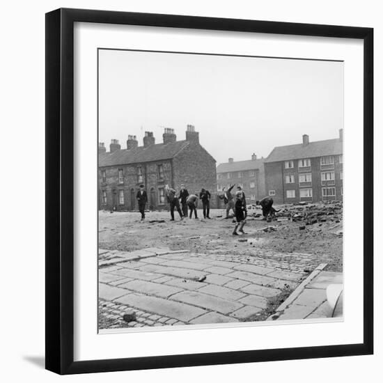 Children in a Deserted Liverpool Street Throw Bricks and Rubble-Henry Grant-Framed Photographic Print