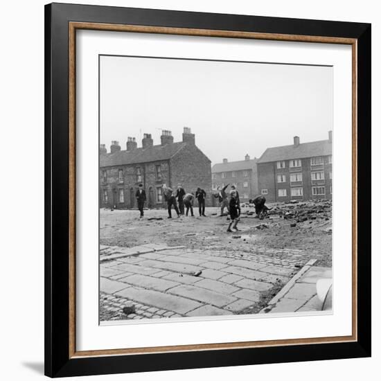 Children in a Deserted Liverpool Street Throw Bricks and Rubble-Henry Grant-Framed Photographic Print