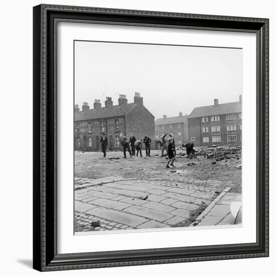 Children in a Deserted Liverpool Street Throw Bricks and Rubble-Henry Grant-Framed Photographic Print