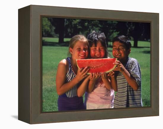 Children in Park Eating Watermelon-Mark Gibson-Framed Premier Image Canvas
