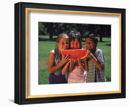 Children in Park Eating Watermelon-Mark Gibson-Framed Photographic Print