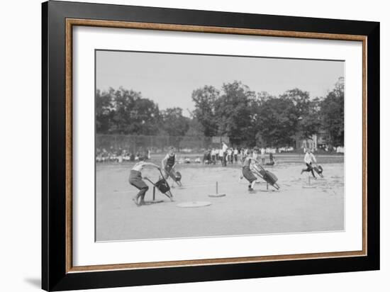 Children In Wheel Barrow Race-null-Framed Art Print