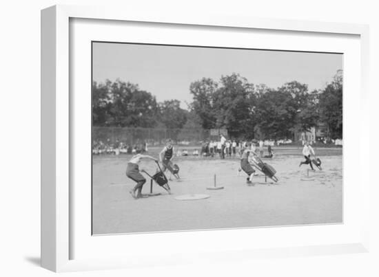 Children In Wheel Barrow Race-null-Framed Art Print