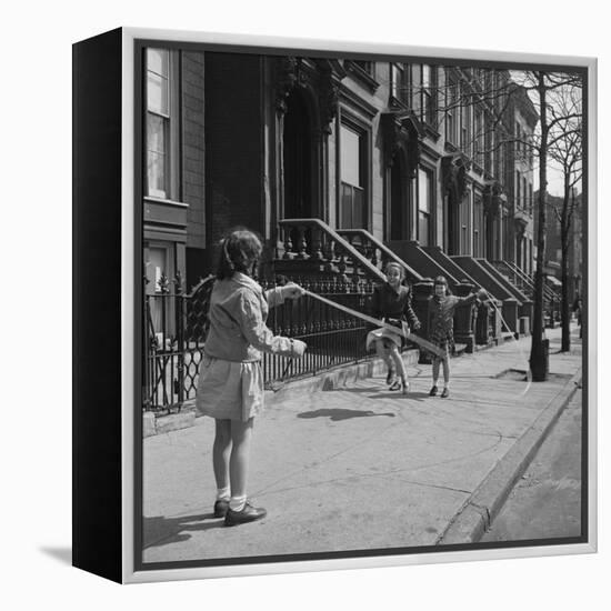Children Jump Roping on Sidewalk Next to Brooklyn Brownstones, NY, 1949-Ralph Morse-Framed Premier Image Canvas
