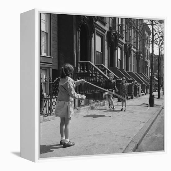 Children Jump Roping on Sidewalk Next to Brooklyn Brownstones, NY, 1949-Ralph Morse-Framed Premier Image Canvas