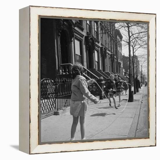 Children Jump Roping on Sidewalk Next to Brooklyn Brownstones, NY, 1949-Ralph Morse-Framed Premier Image Canvas