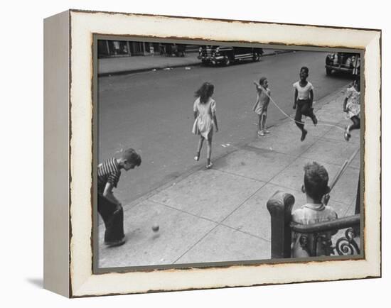 Children Jumping Rope on Sidewalk-Ed Clark-Framed Premier Image Canvas