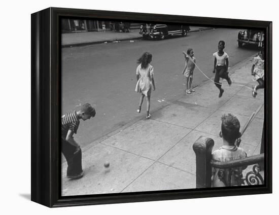 Children Jumping Rope on Sidewalk-Ed Clark-Framed Premier Image Canvas