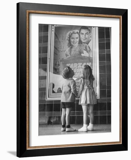 Children Looking at Posters Outside Movie Theater-Charles E^ Steinheimer-Framed Photographic Print