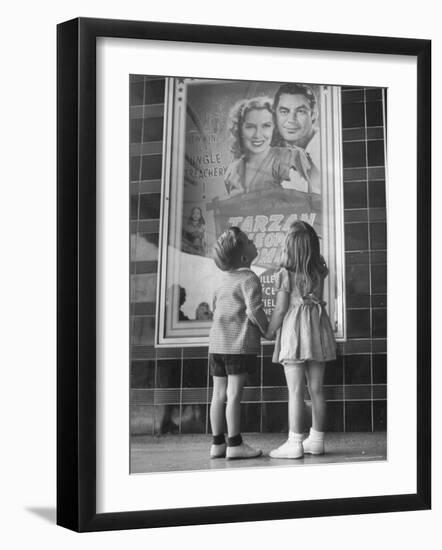 Children Looking at Posters Outside Movie Theater-Charles E^ Steinheimer-Framed Photographic Print