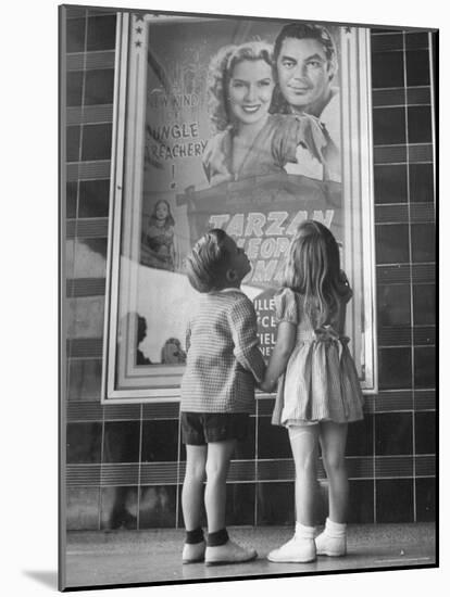 Children Looking at Posters Outside Movie Theater-Charles E^ Steinheimer-Mounted Photographic Print