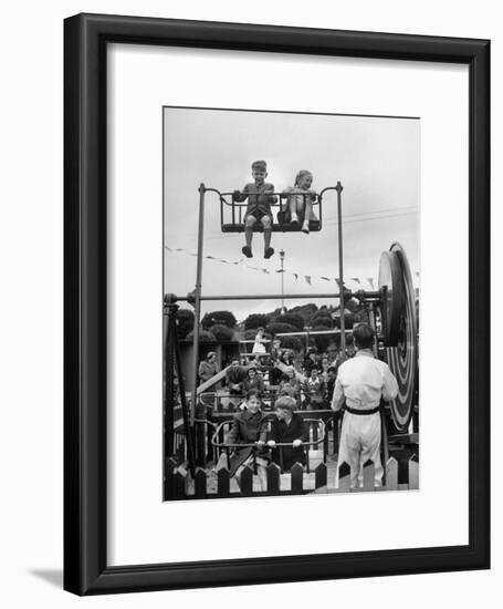 Children on Rides at an Amusement Park at a Beach Resort-null-Framed Photographic Print