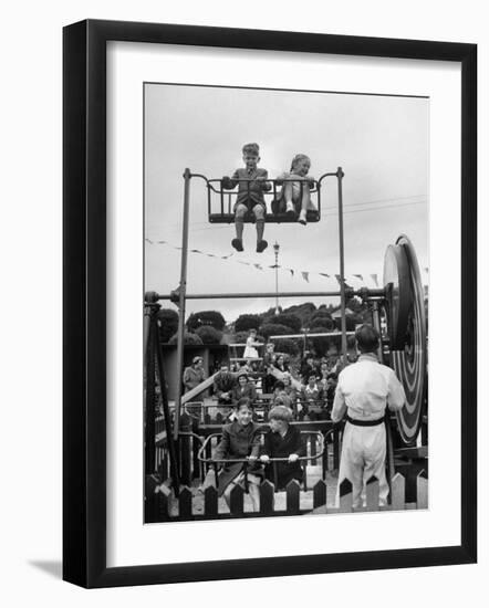 Children on Rides at an Amusement Park at a Beach Resort-null-Framed Photographic Print