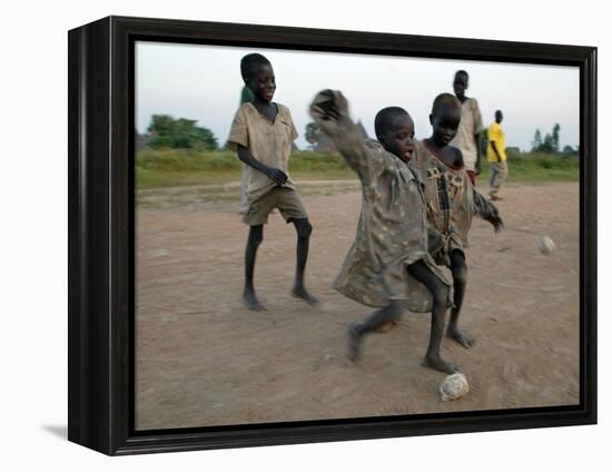 Children Play with Homemade Soccer Balls Made from Discarded Medical Gloves-null-Framed Premier Image Canvas