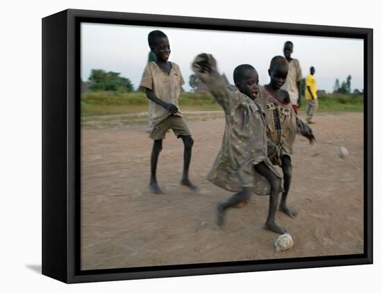 Children Play with Homemade Soccer Balls Made from Discarded Medical Gloves-null-Framed Premier Image Canvas