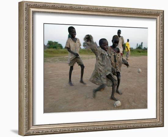 Children Play with Homemade Soccer Balls Made from Discarded Medical Gloves-null-Framed Photographic Print