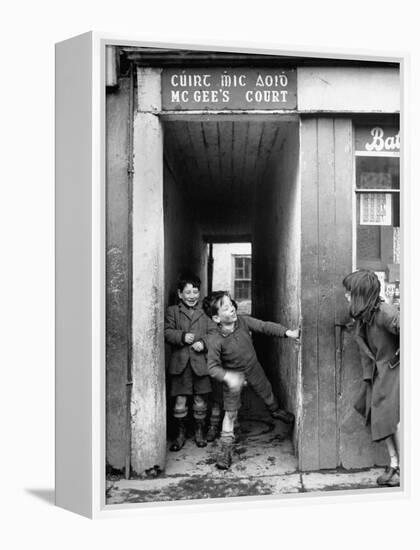 Children Playing at the Entrance to McGee's Court Slum on Camden Street-Tony Linck-Framed Premier Image Canvas