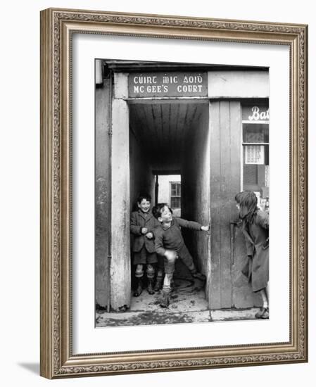 Children Playing at the Entrance to McGee's Court Slum on Camden Street-Tony Linck-Framed Photographic Print