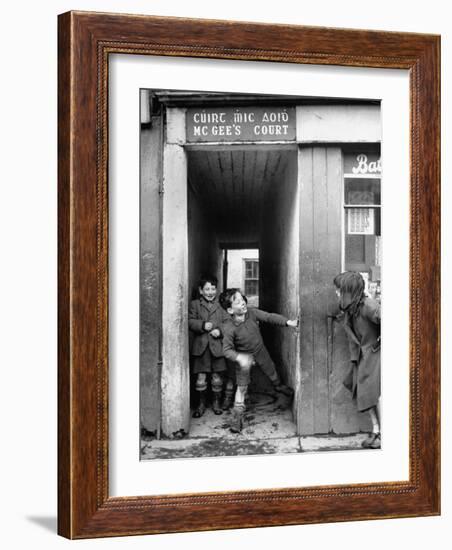 Children Playing at the Entrance to McGee's Court Slum on Camden Street-Tony Linck-Framed Photographic Print