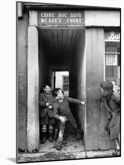 Children Playing at the Entrance to McGee's Court Slum on Camden Street-Tony Linck-Mounted Photographic Print