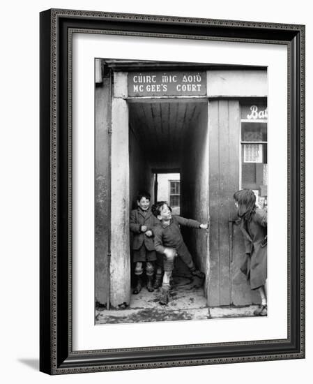 Children Playing at the Entrance to McGee's Court Slum on Camden Street-Tony Linck-Framed Photographic Print