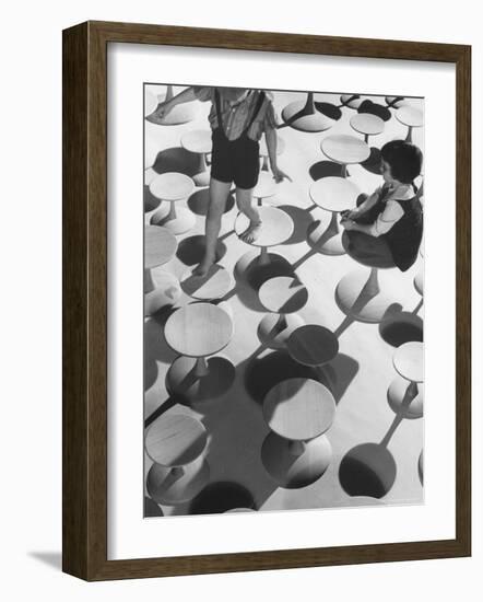 Children Playing Atop Modern Furniture-Michael Rougier-Framed Photographic Print