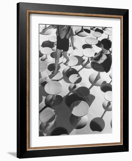 Children Playing Atop Modern Furniture-Michael Rougier-Framed Photographic Print