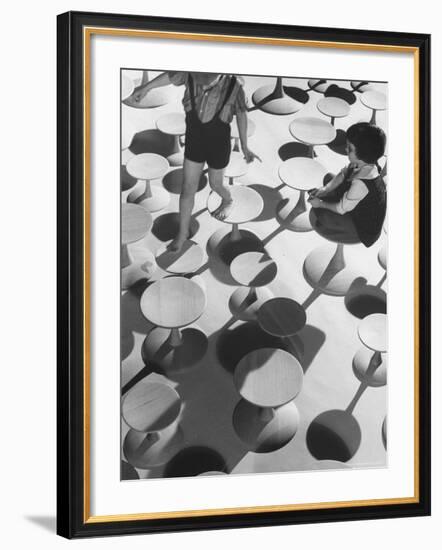 Children Playing Atop Modern Furniture-Michael Rougier-Framed Photographic Print