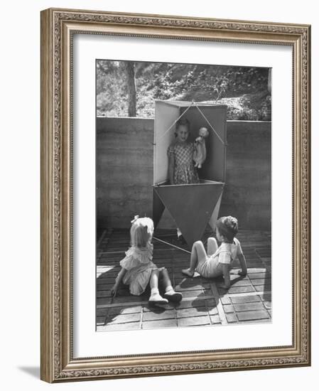 Children Playing in a Toy Made by Charles Eames-Allan Grant-Framed Photographic Print