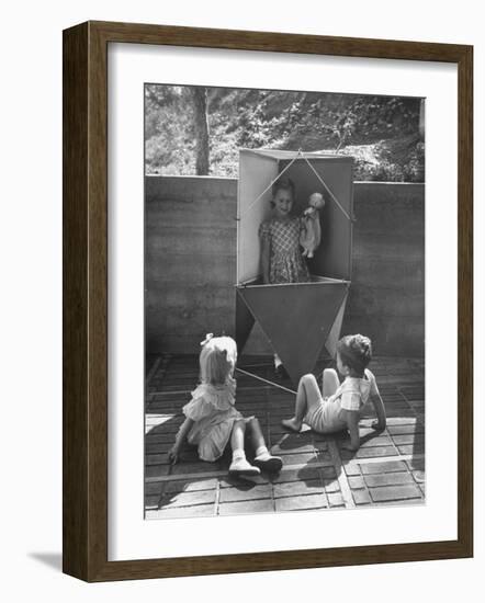 Children Playing in a Toy Made by Charles Eames-Allan Grant-Framed Photographic Print