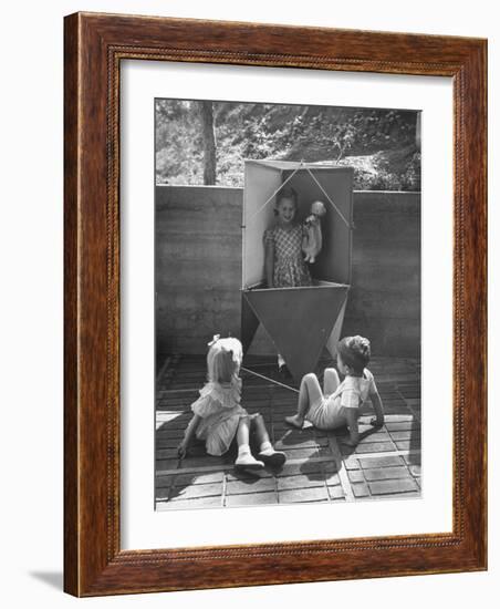 Children Playing in a Toy Made by Charles Eames-Allan Grant-Framed Photographic Print