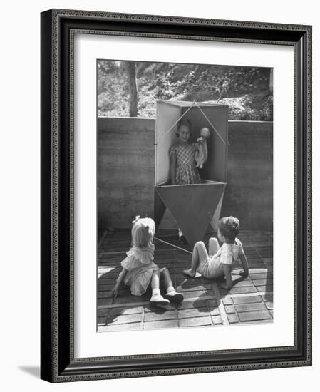 Children Playing in a Toy Made by Charles Eames-Allan Grant-Framed Photographic Print