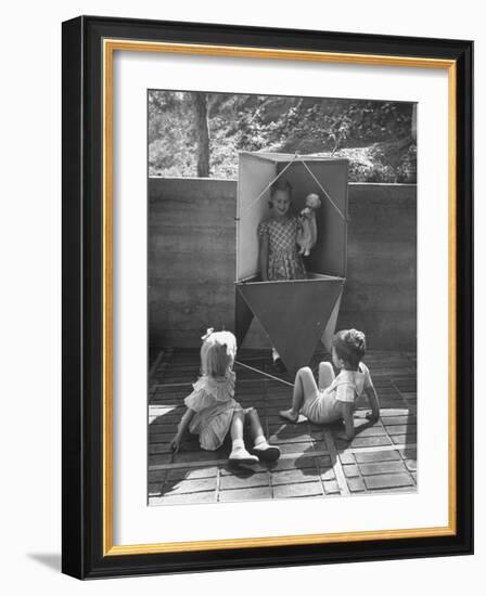 Children Playing in a Toy Made by Charles Eames-Allan Grant-Framed Photographic Print