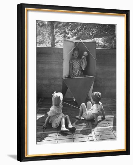 Children Playing in a Toy Made by Charles Eames-Allan Grant-Framed Photographic Print