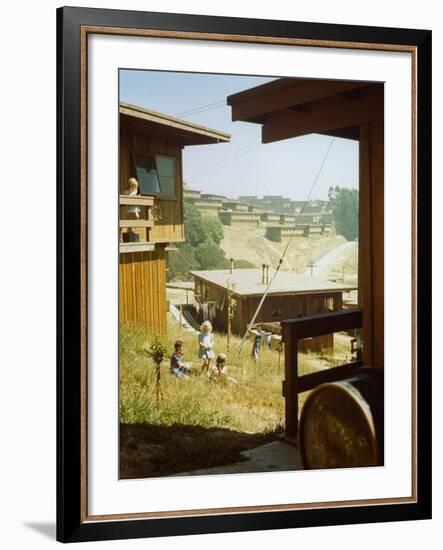 Children Playing in Backyard in Government Housing Project for Bechtel-Managed Shipyards Workers-Andreas Feininger-Framed Premium Photographic Print